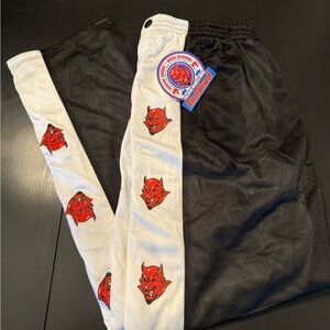 Third Rail 90,s tear away track pants. Featuring red devil logo. Vintage, NWT